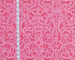 Pink polka dotted scrolling fabric arabesque